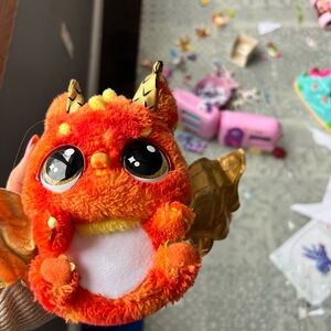 Vibrant Orange Plush Dragon with Golden Accents